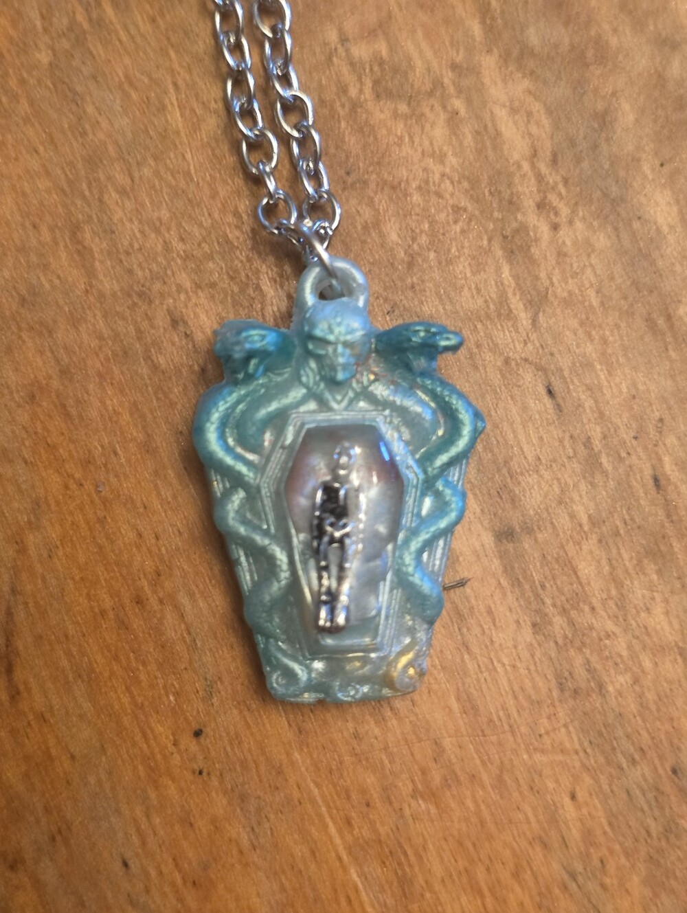 Green Serpent Coffin With Skeleton Resting Inside On Silver Tone Chain Necklace